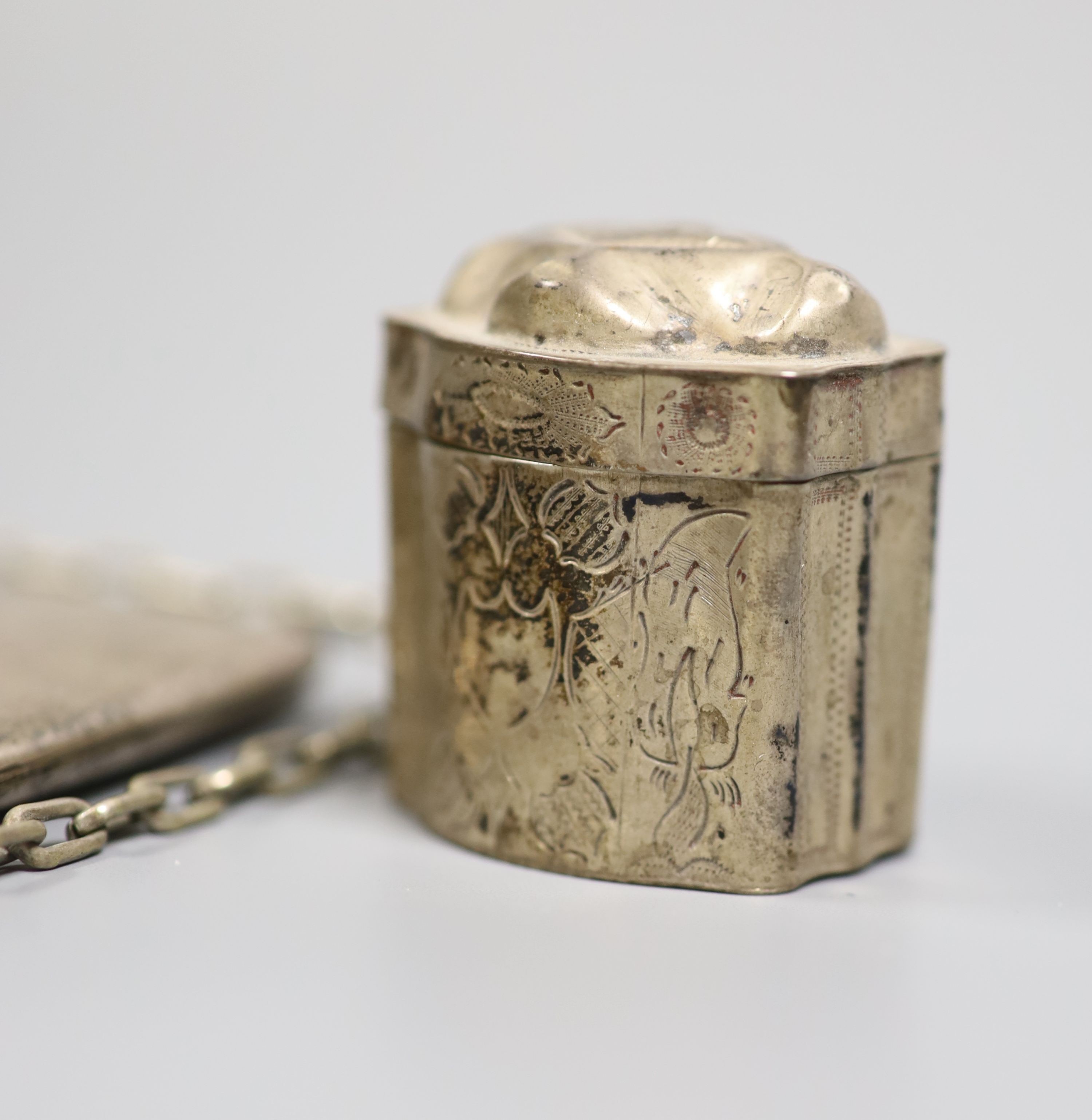 A late Victorian silver shoe vinaigrette, import marks for Sheffield, 1896, 7cm, one other continental white meta box, a silver cigarette case and a mesh evening bag.